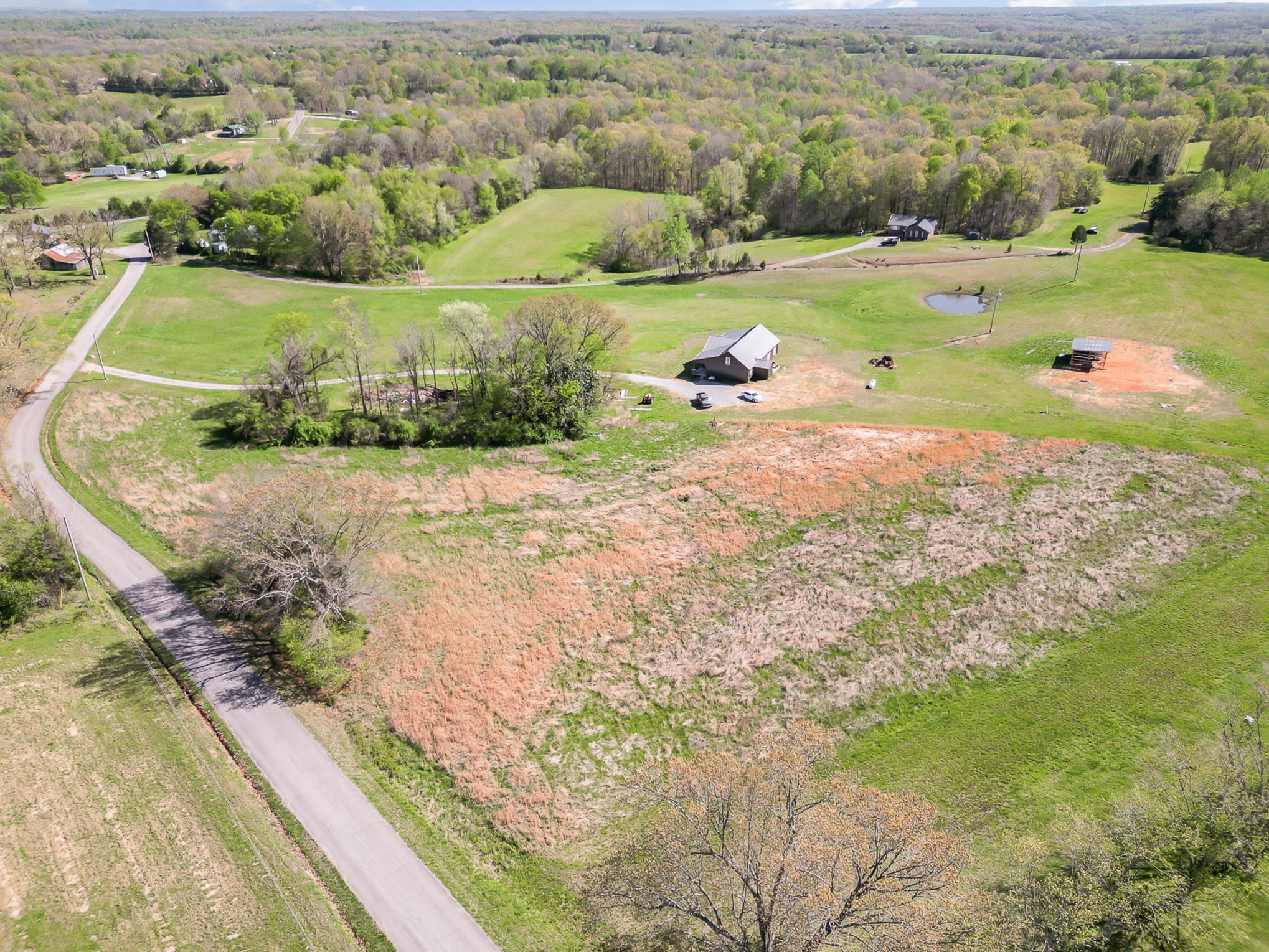 3 Batson Mill Road Charlotte, TN 37036 - Photo 1 of 4 an aerial view of a houses with outdoor space