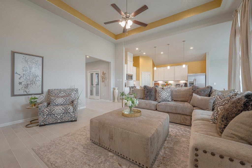 1061 Apple Ridge Road Magnolia, TX 77355 - Photo 11 of 49 a living room with furniture and a chandelier