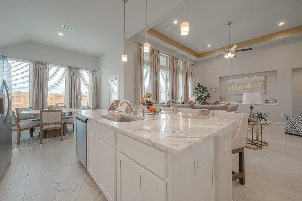 1061 Apple Ridge Road Magnolia, TX 77355 - Photo 17 of 49 a bathroom with sinks a large mirror and a bathtub