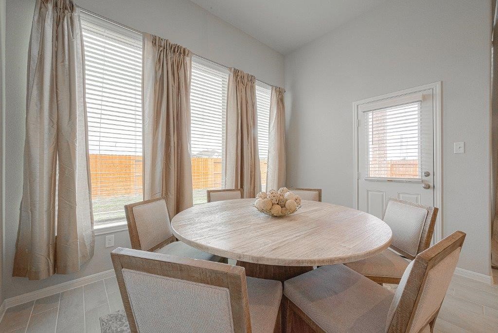 1061 Apple Ridge Road Magnolia, TX 77355 - Photo 22 of 49 a dining room with furniture and window