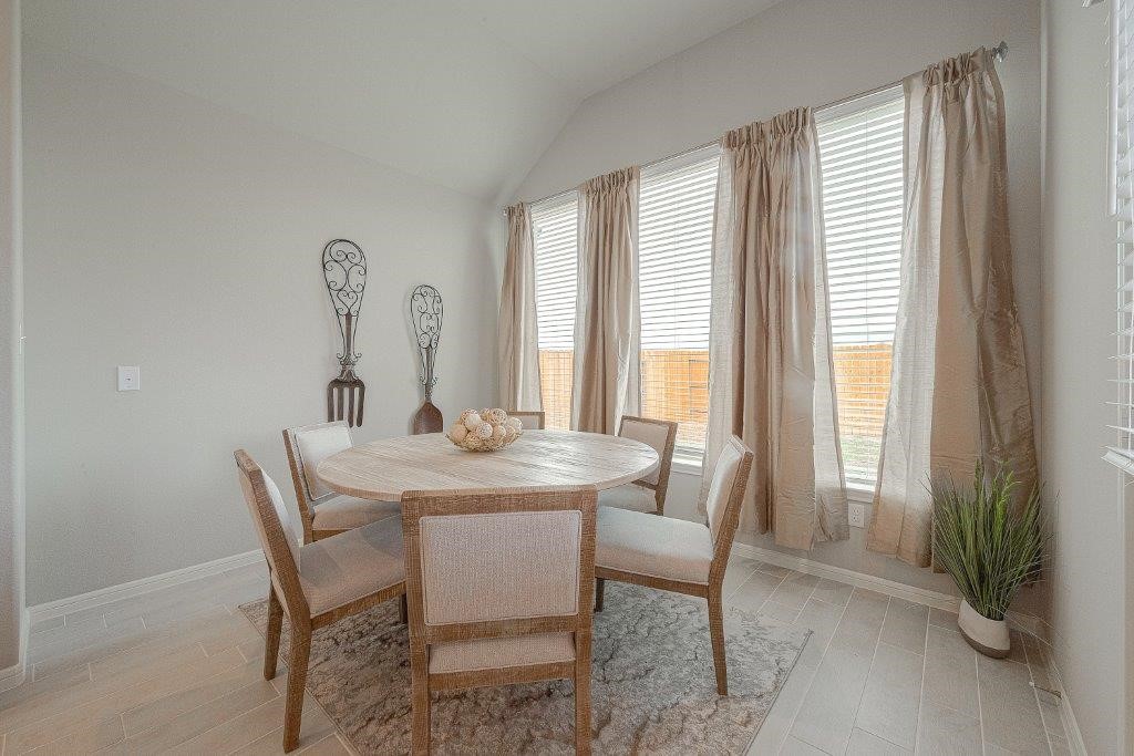 1061 Apple Ridge Road Magnolia, TX 77355 - Photo 23 of 49 a view of a dining room with furniture and a window