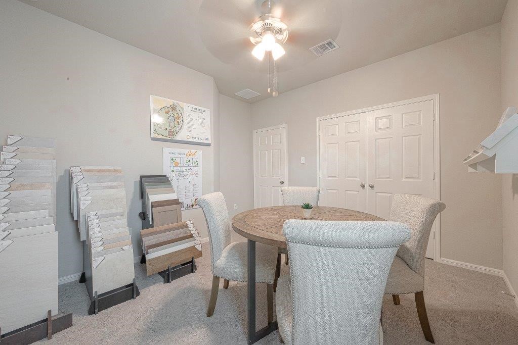 1061 Apple Ridge Road Magnolia, TX 77355 - Photo 27 of 49 a dining room with furniture and a chandelier