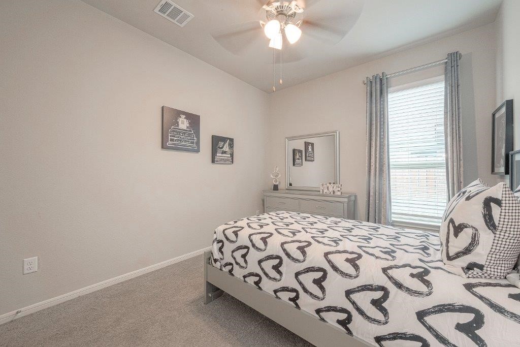 1061 Apple Ridge Road Magnolia, TX 77355 - Photo 28 of 49 a bedroom with a bed and a window