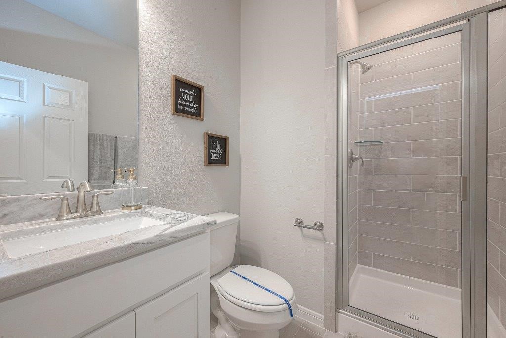 1061 Apple Ridge Road Magnolia, TX 77355 - Photo 30 of 49 a bathroom with a sink a toilet and shower
