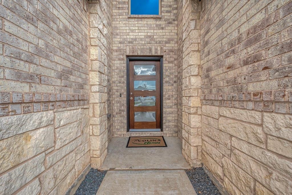 1061 Apple Ridge Road Magnolia, TX 77355 - Photo 3 of 49 a view of a pathway both side of door
