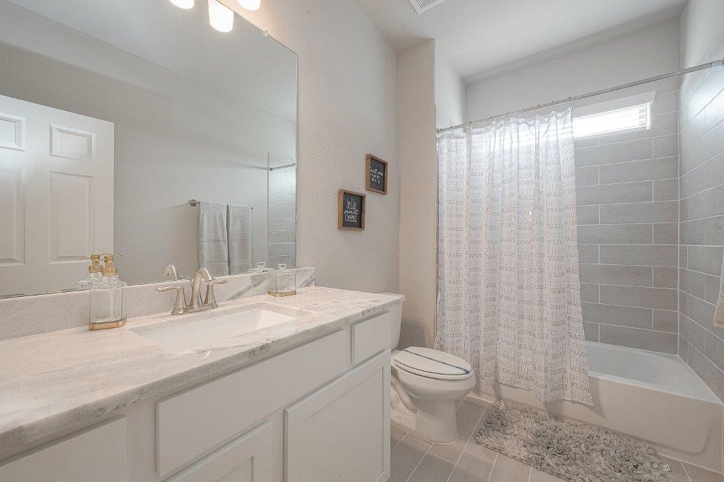 1061 Apple Ridge Road Magnolia, TX 77355 - Photo 34 of 49 a bathroom with a granite countertop sink a toilet and shower