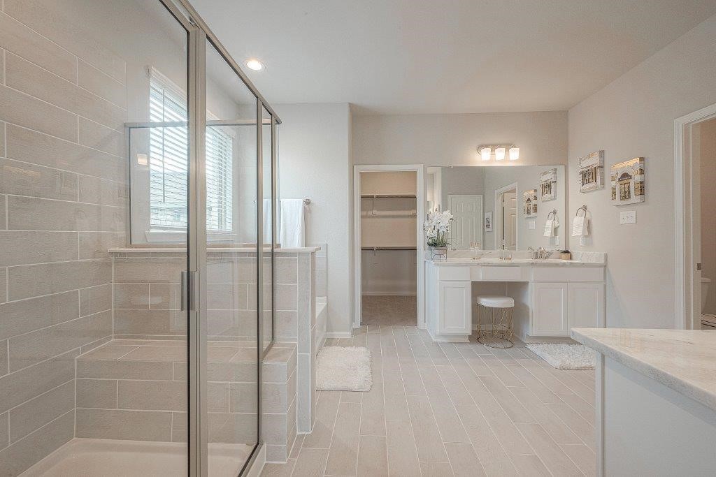 1061 Apple Ridge Road Magnolia, TX 77355 - Photo 39 of 49 a bathroom with a shower sink and mirror