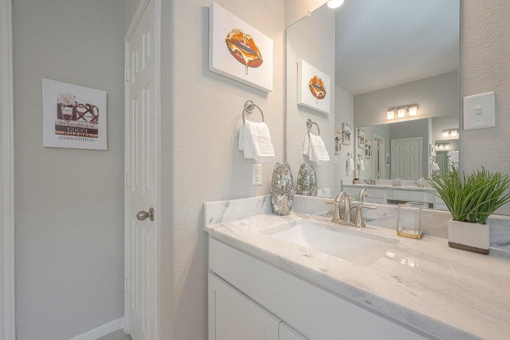 1061 Apple Ridge Road Magnolia, TX 77355 - Photo 41 of 49 a bathroom with a sink and a mirror