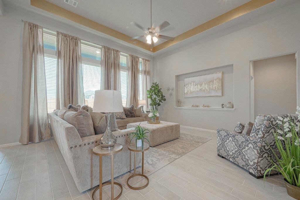 1061 Apple Ridge Road Magnolia, TX 77355 - Photo 9 of 49 a living room with furniture and a large window