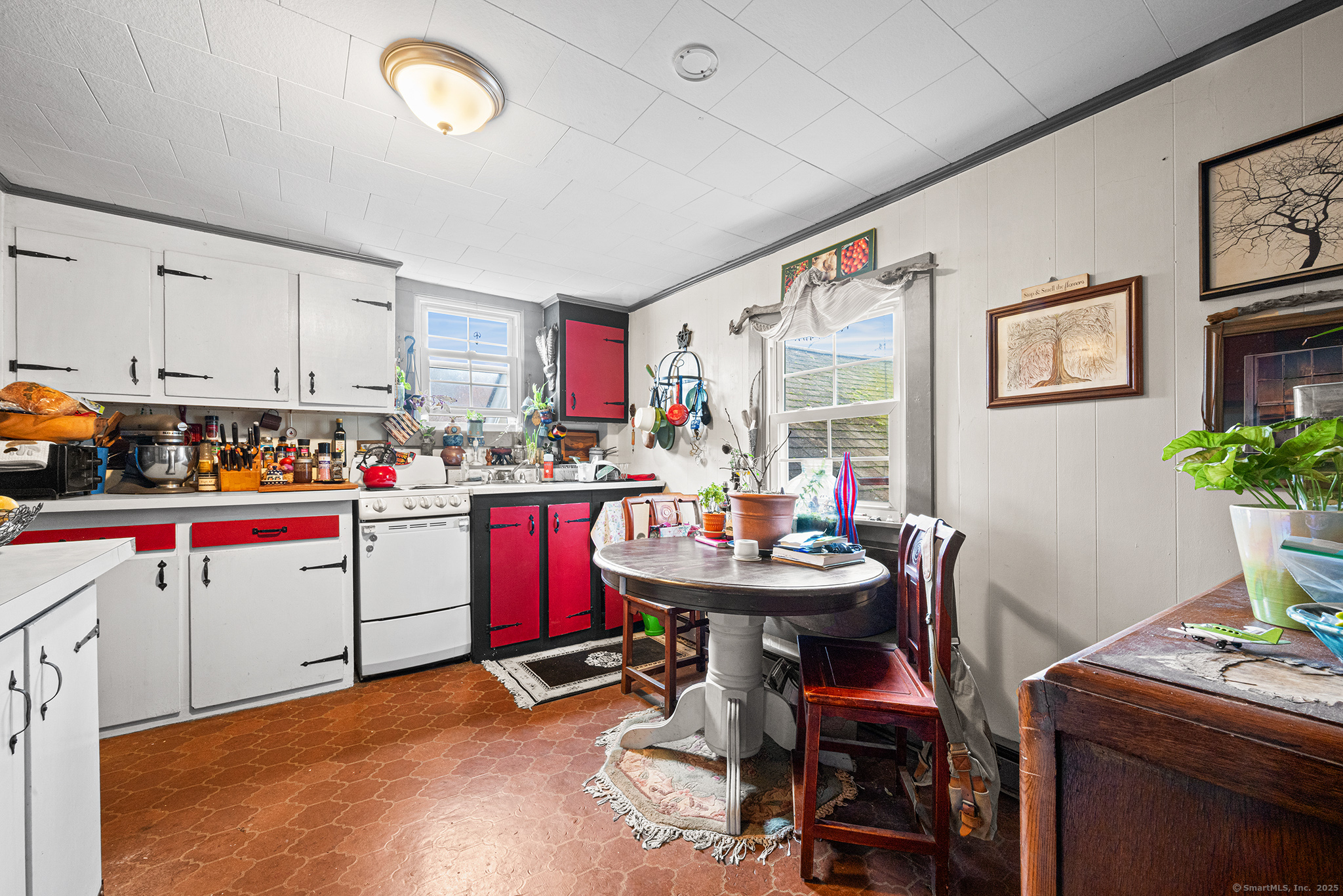 2 Norwich Road East Haddam, CT 06423 - Photo 16 of 39 a view of a kitchen with kitchen island dining table and chairs