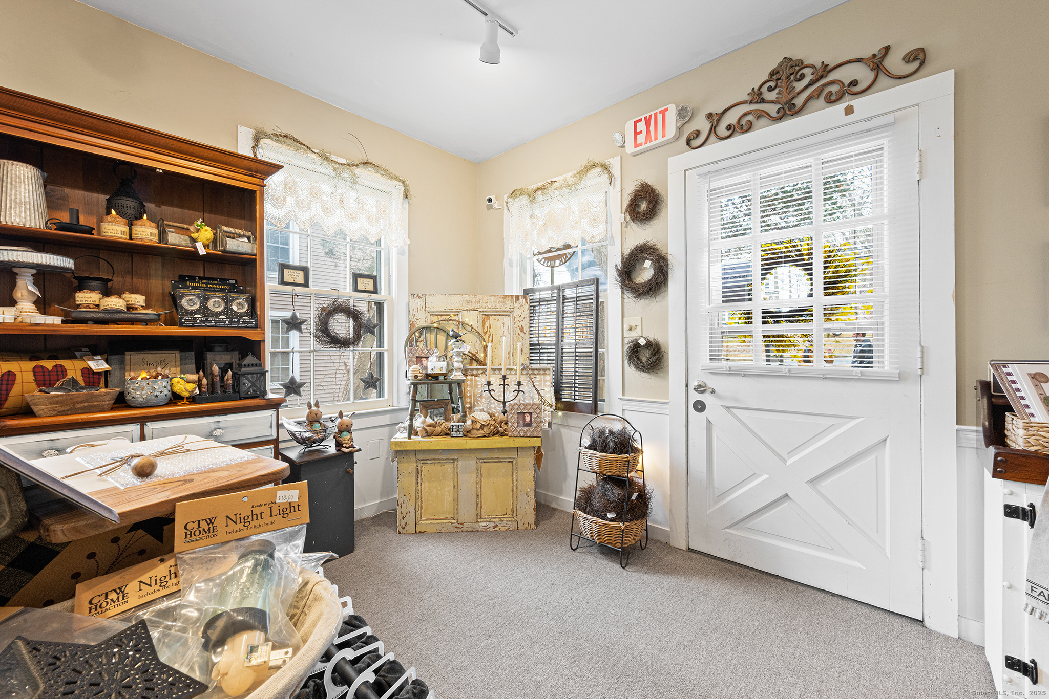 2 Norwich Road East Haddam, CT 06423 - Photo 21 of 39 a living room with furniture and a book shelf
