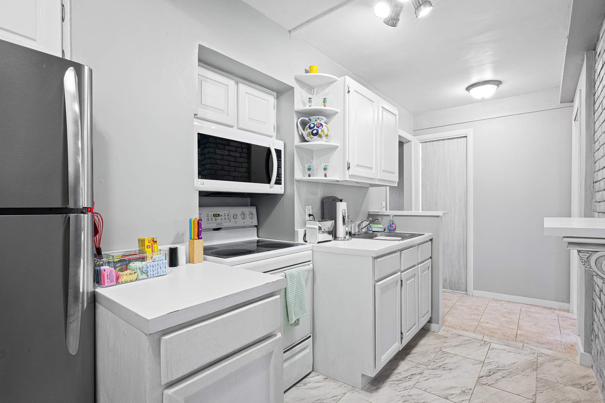 2 Norwich Road East Haddam, CT 06423 - Photo 8 of 39 a kitchen with a sink stove and refrigerator