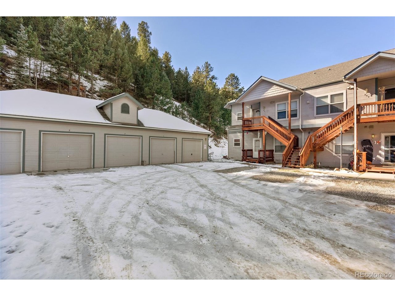 5720 Co Road, Unit 101A Bailey, CO 80421 - Photo 2 of 46 and garage is the one closest to the unit.