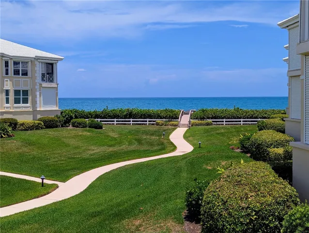 a view of a lake with a building in the background