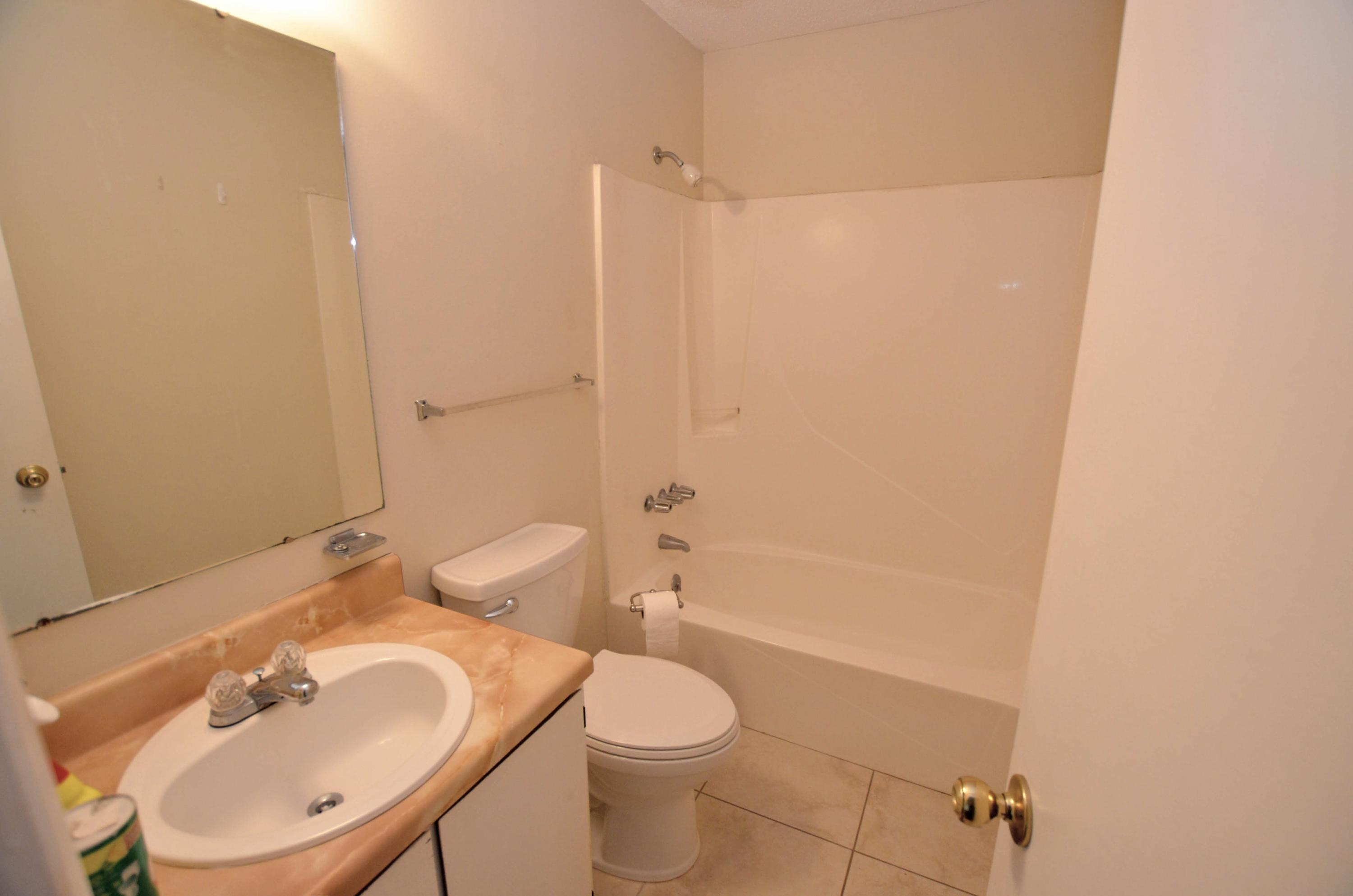 81 Cross Creek Road, Unit 22 Miramar Beach, FL 32550 - Photo 13 of 13 a bathroom with a sink toilet and shower