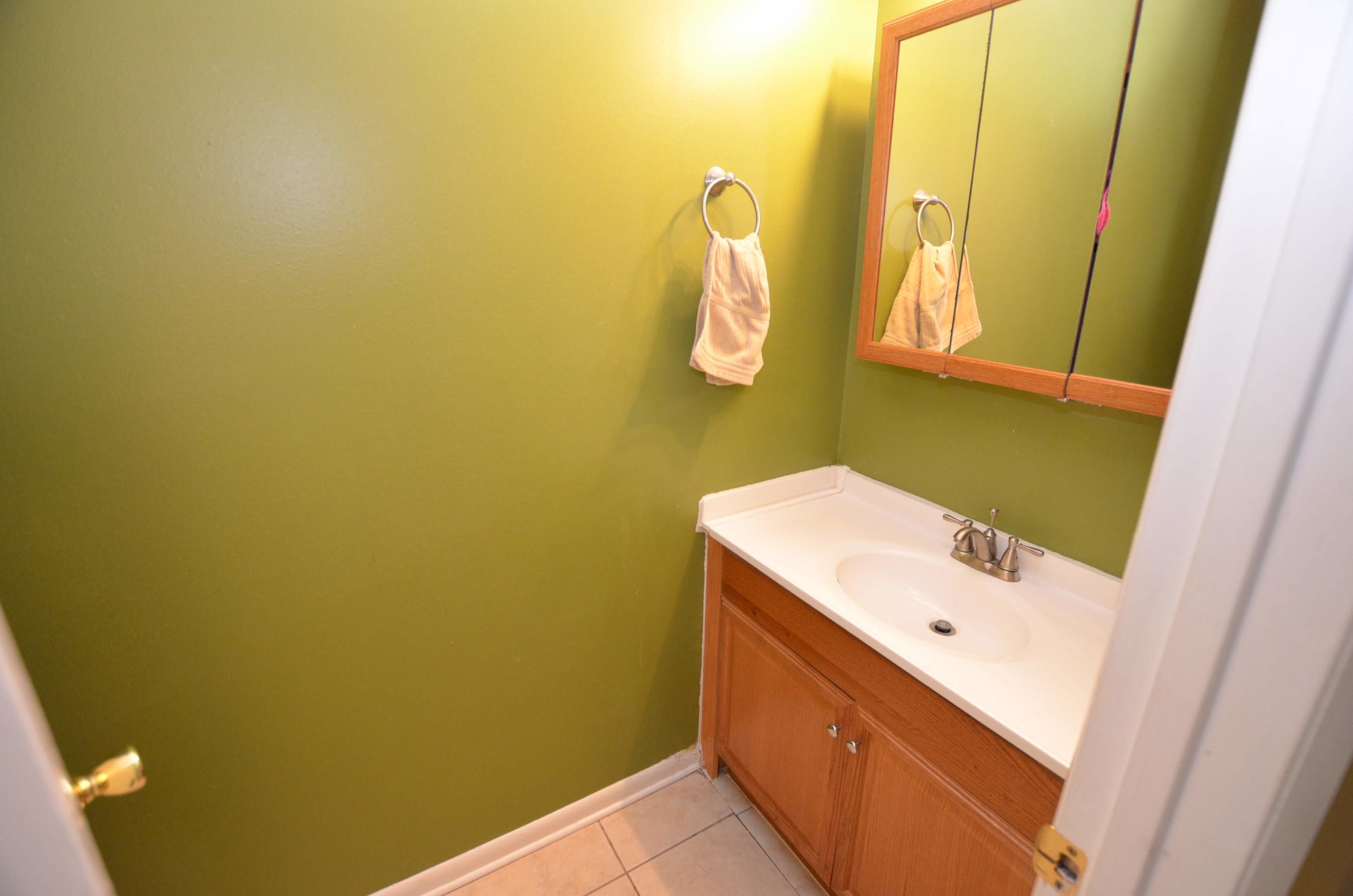 81 Cross Creek Road, Unit 22 Miramar Beach, FL 32550 - Photo 4 of 13 a bathroom with a sink and a mirror