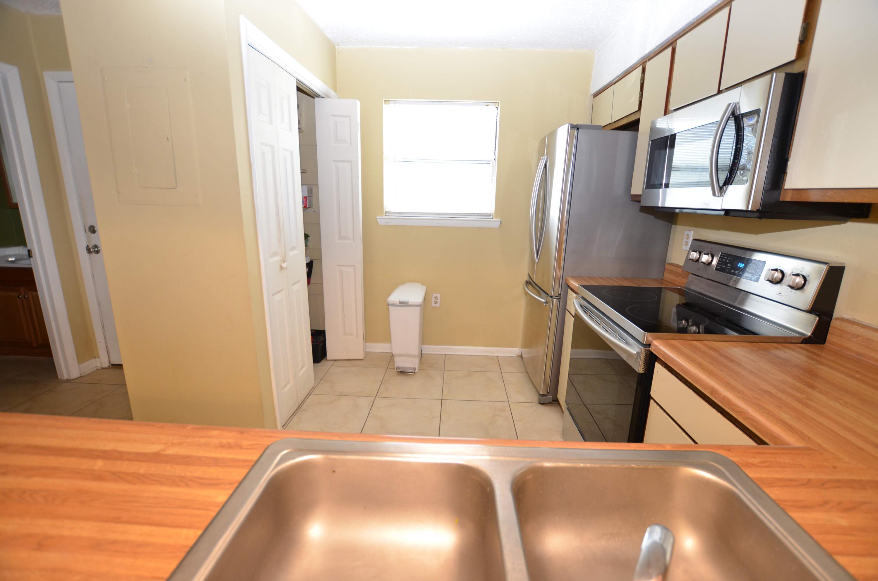 81 Cross Creek Road, Unit 22 Miramar Beach, FL 32550 - Photo 6 of 13 a bedroom with a bed and a flat screen tv