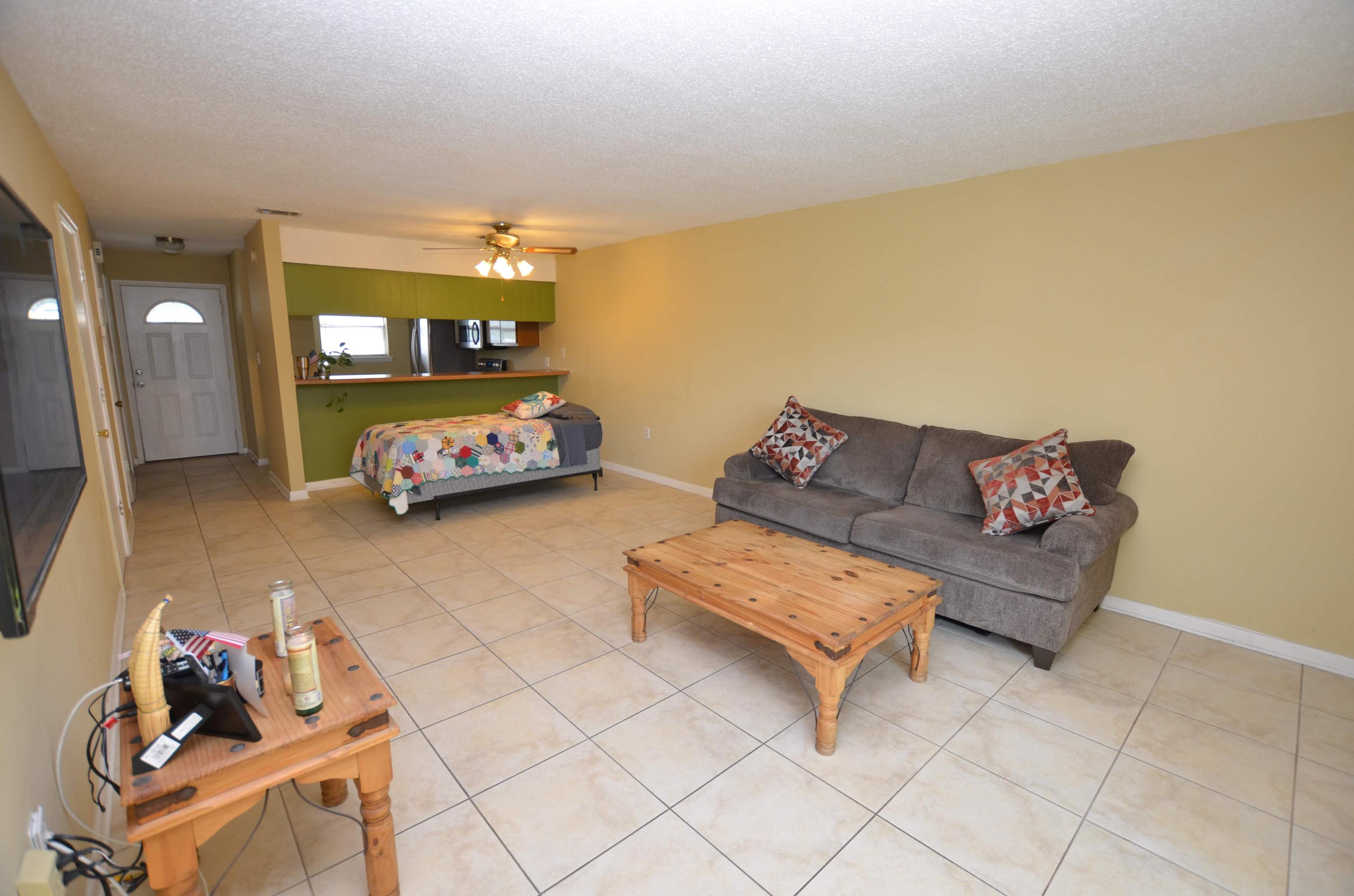 81 Cross Creek Road, Unit 22 Miramar Beach, FL 32550 - Photo 8 of 13 a living room with furniture and a couch