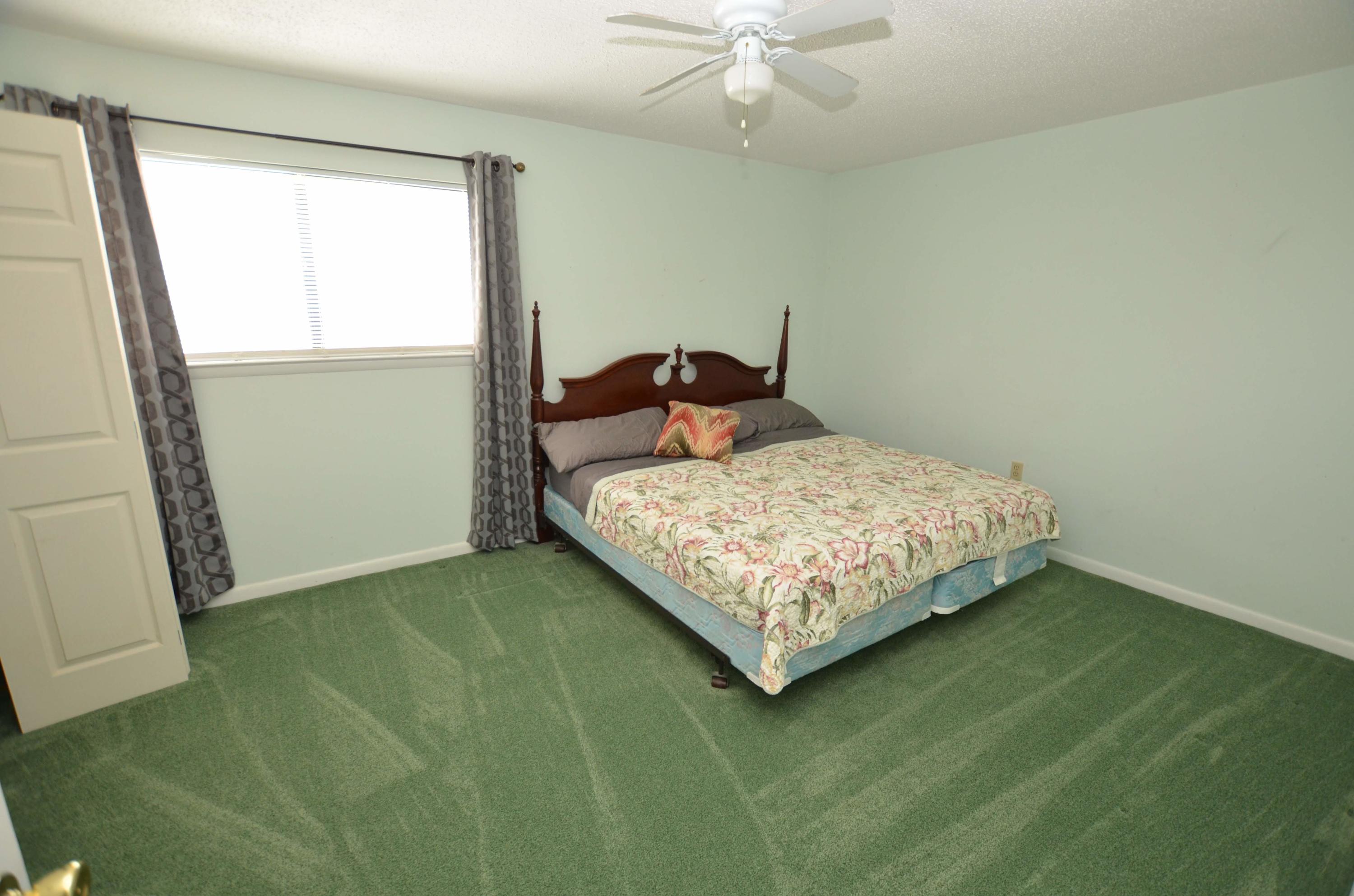 81 Cross Creek Road, Unit 22 Miramar Beach, FL 32550 - Photo 10 of 13 a bedroom with a bed and window