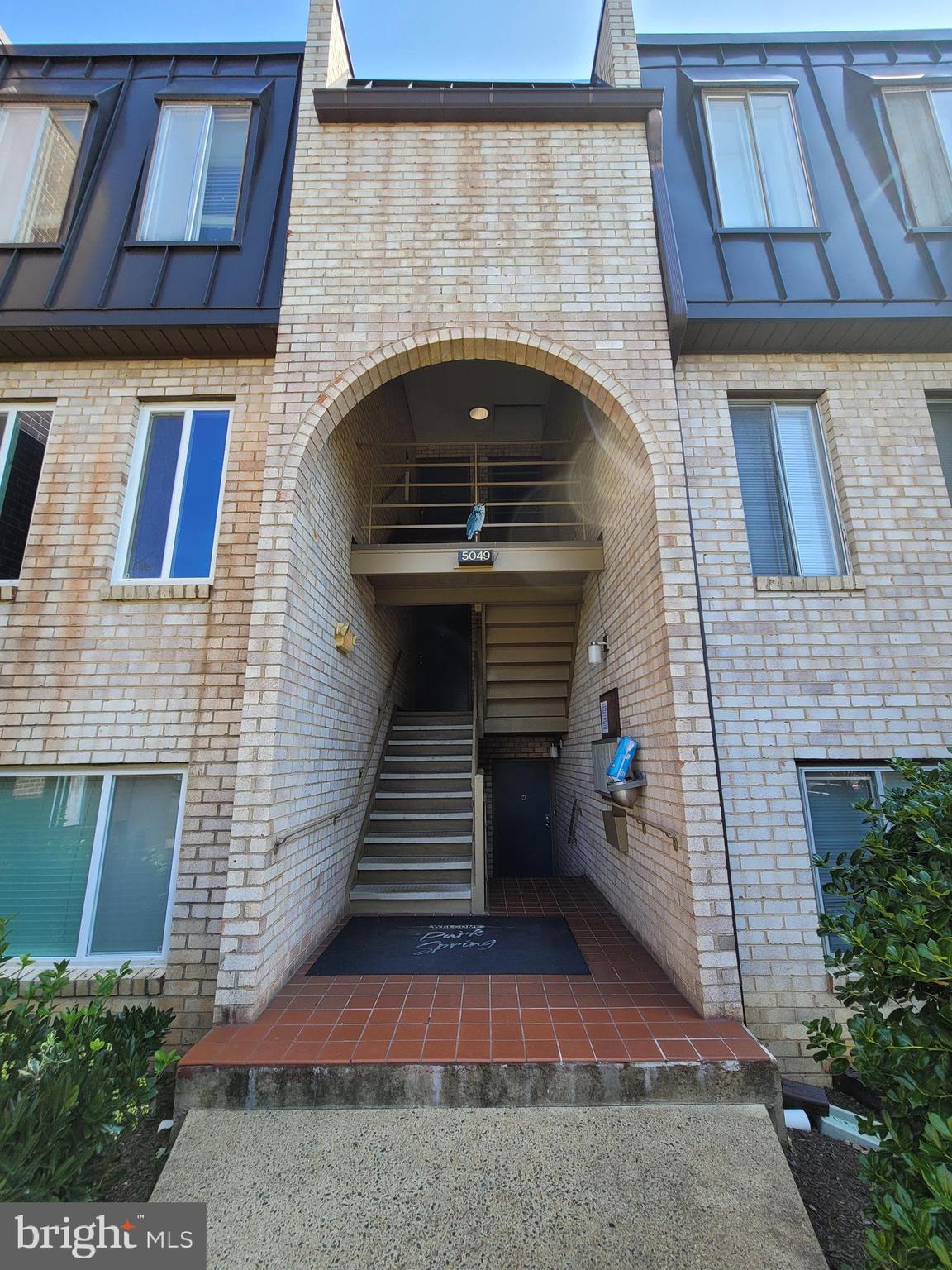 5049 7th Road South, Unit 201 Arlington, VA 22204 - Photo 1 of 45 a front view of a house with large windows