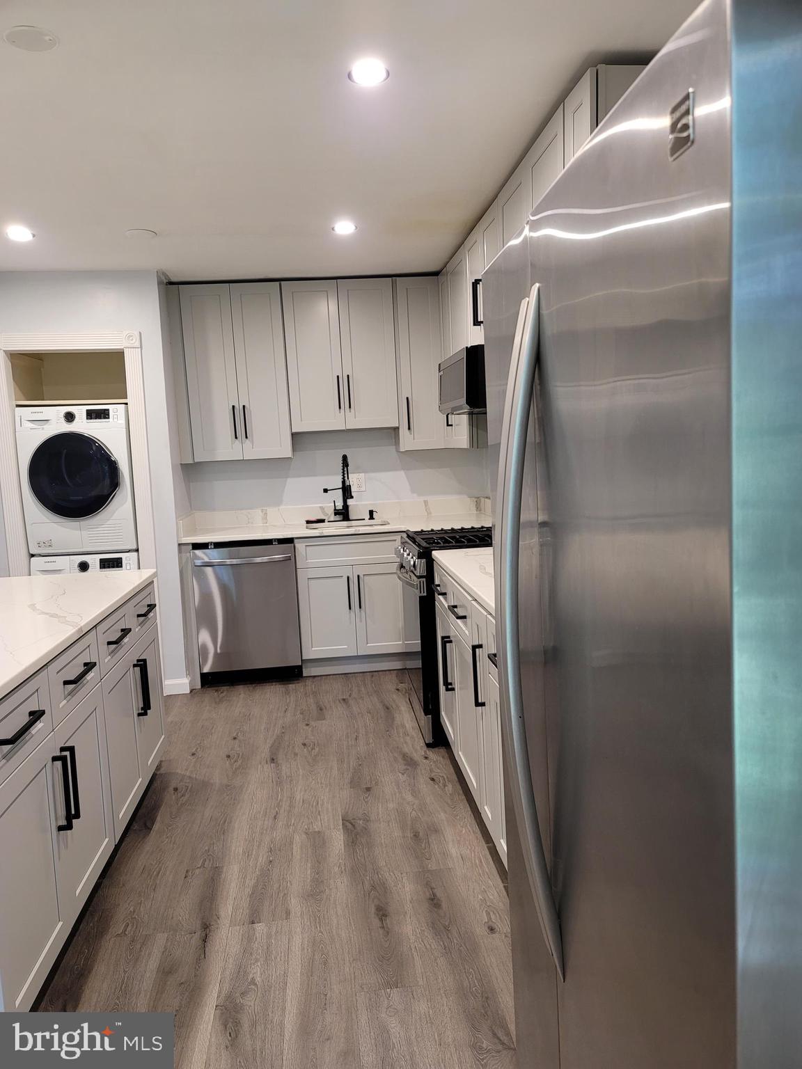 5049 7th Road South, Unit 201 Arlington, VA 22204 - Photo 12 of 45 a kitchen with appliances cabinets and a sink