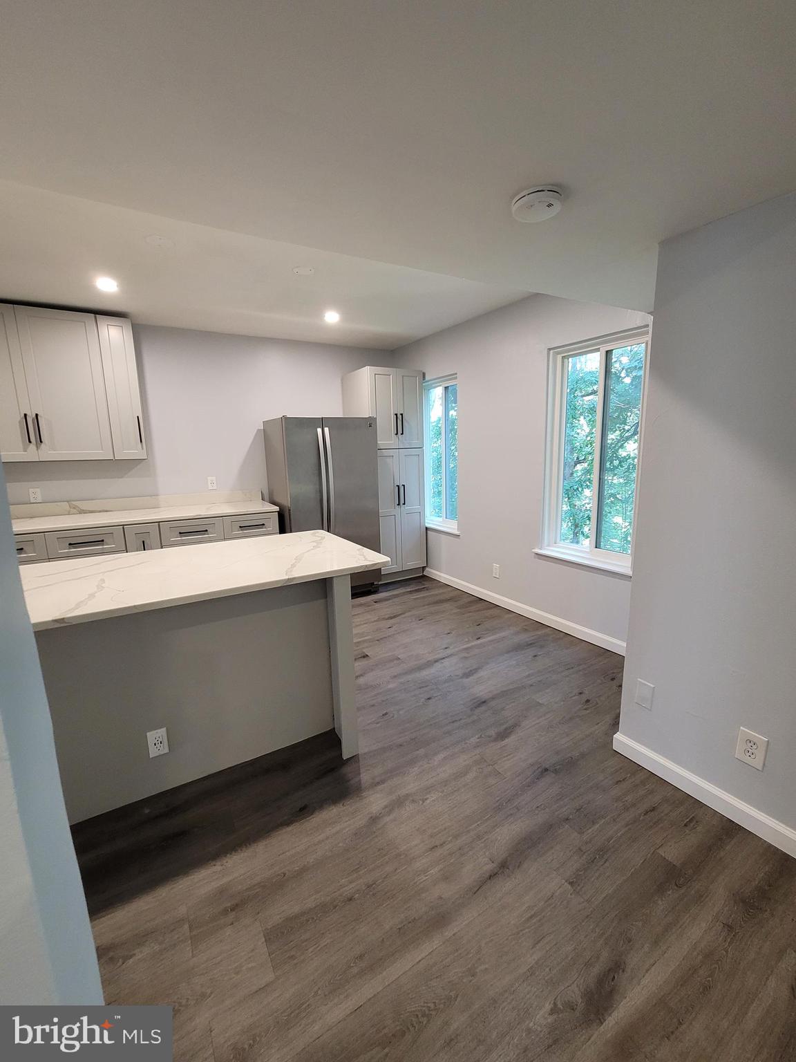 5049 7th Road South, Unit 201 Arlington, VA 22204 - Photo 15 of 45 a view of kitchen with wooden floor