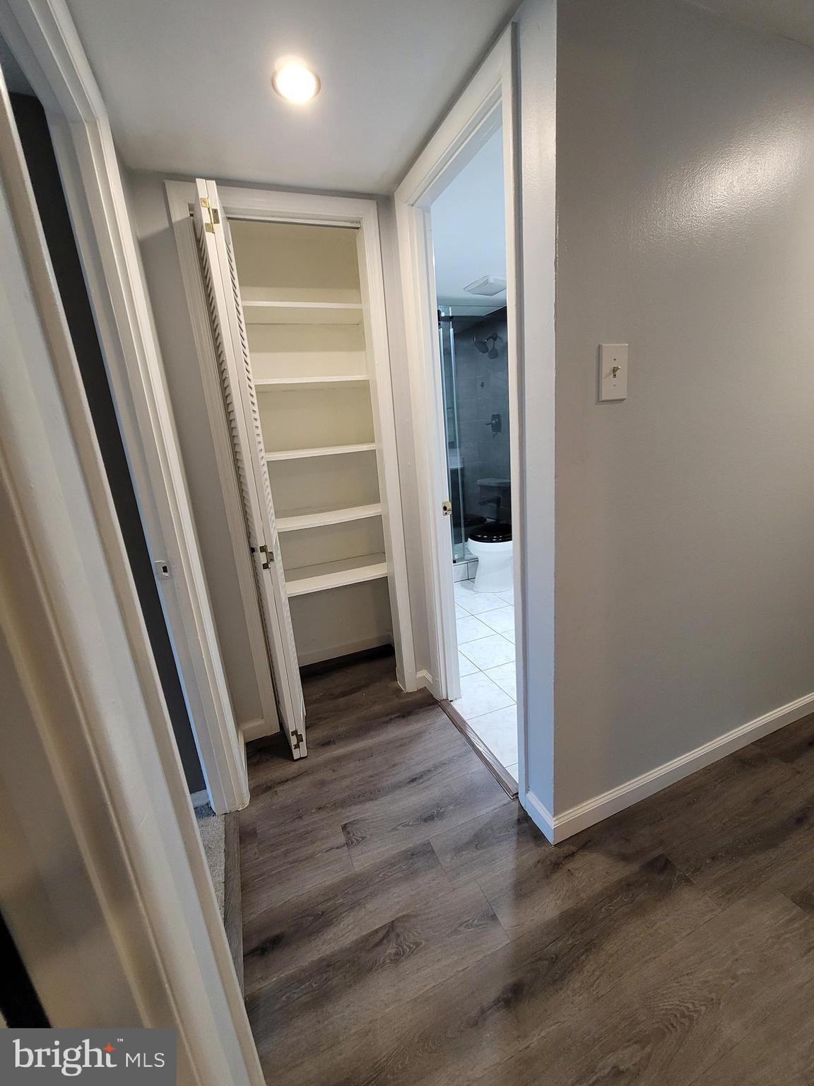 5049 7th Road South, Unit 201 Arlington, VA 22204 - Photo 19 of 45 a view of walk in closet with empty racks