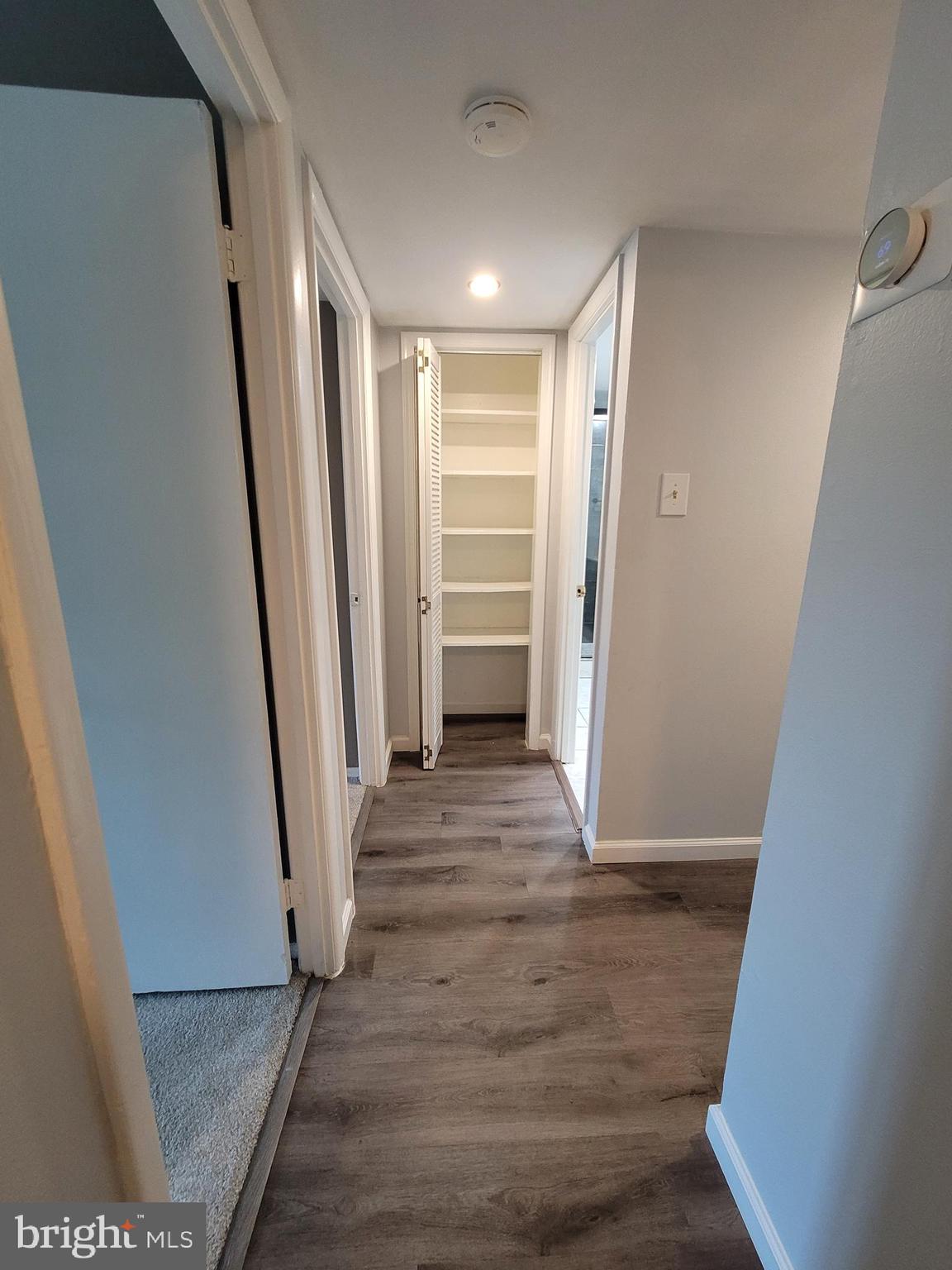 5049 7th Road South, Unit 201 Arlington, VA 22204 - Photo 20 of 45 a view of a hallway with wooden floor and staircase