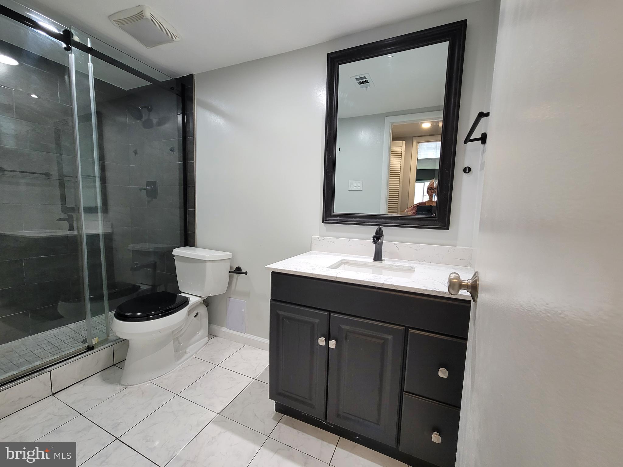 5049 7th Road South, Unit 201 Arlington, VA 22204 - Photo 24 of 45 a bathroom with a sink toilet and shower
