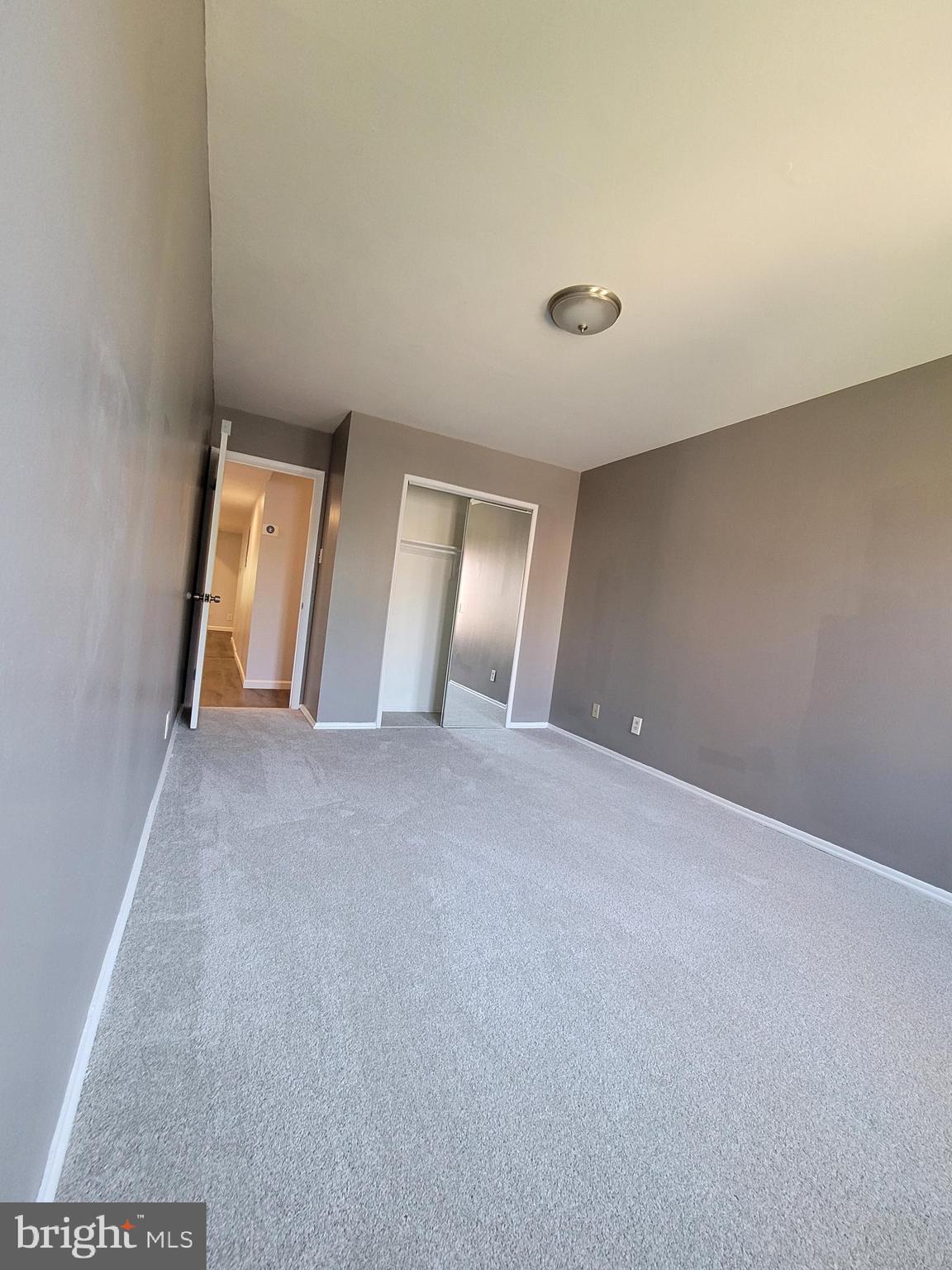 5049 7th Road South, Unit 201 Arlington, VA 22204 - Photo 30 of 45 a view of an empty room and a window