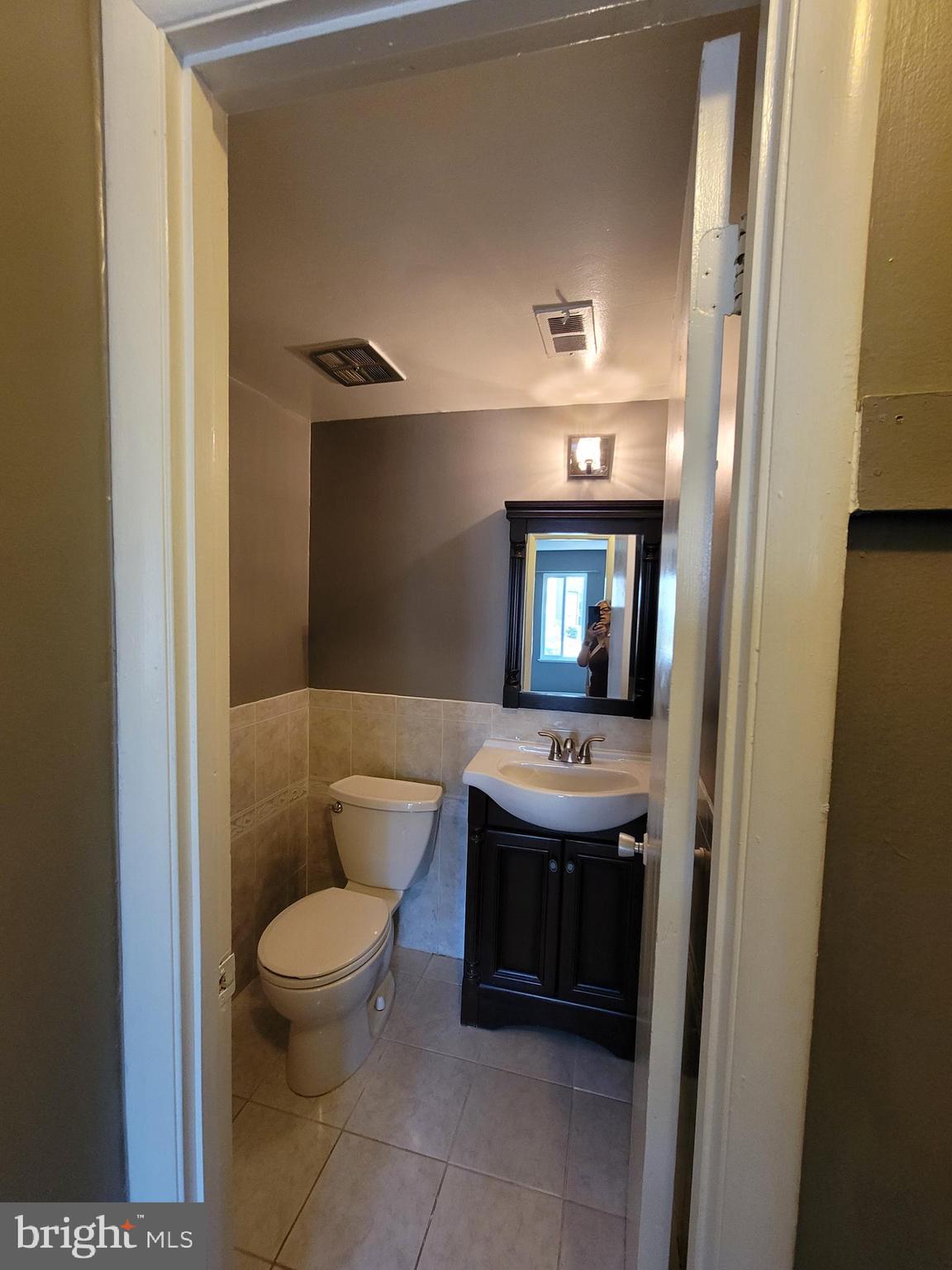 5049 7th Road South, Unit 201 Arlington, VA 22204 - Photo 33 of 45 a bathroom with a sink and a mirror