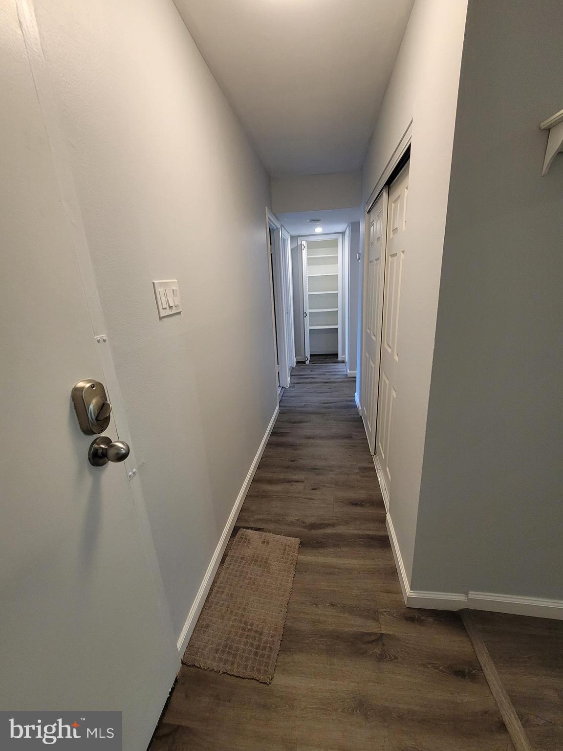 5049 7th Road South, Unit 201 Arlington, VA 22204 - Photo 4 of 45 a view of a hallway with wooden floor and staircase