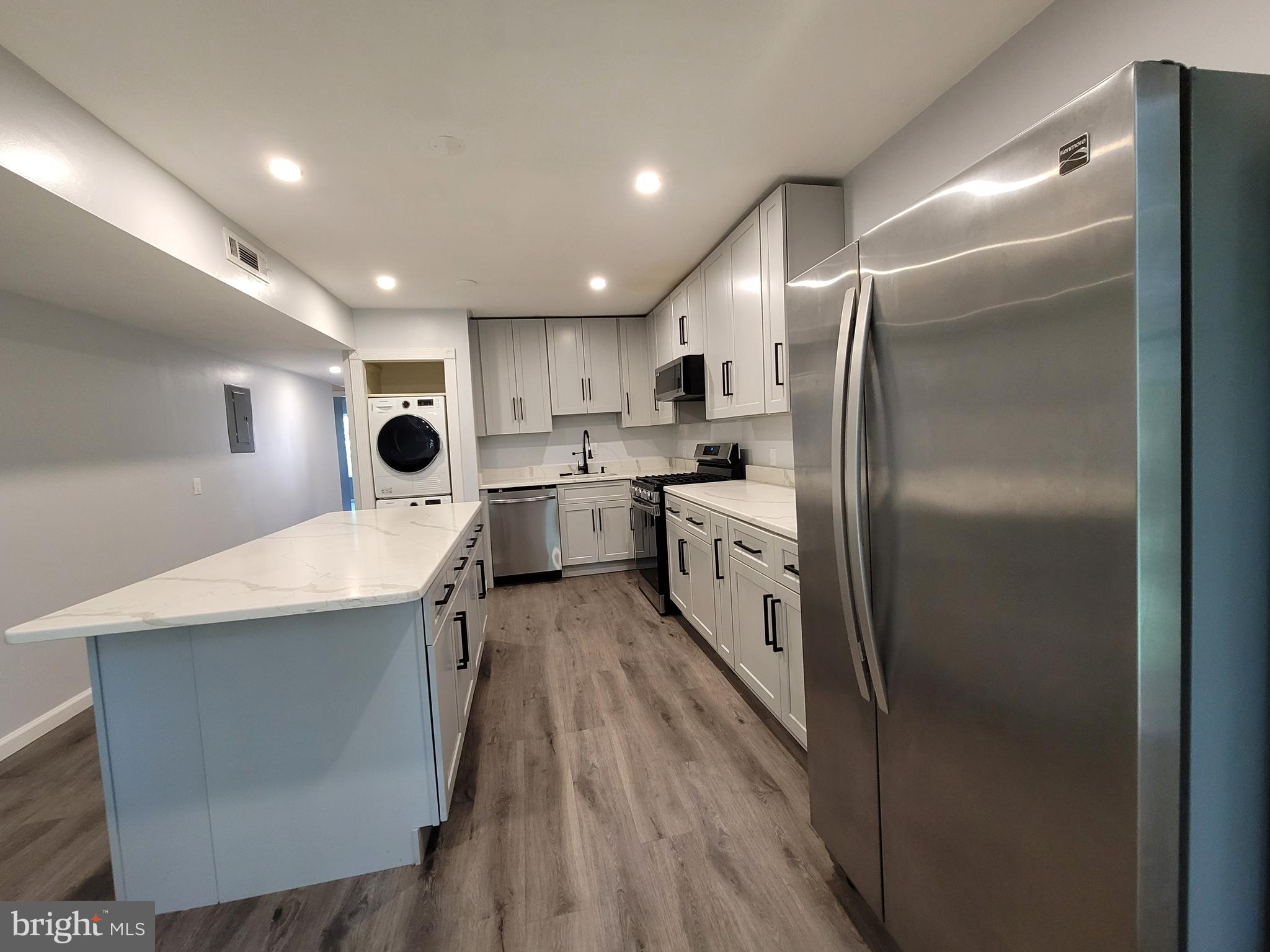 5049 7th Road South, Unit 201 Arlington, VA 22204 - Photo 10 of 45 a large kitchen with a stove a refrigerator and a sink