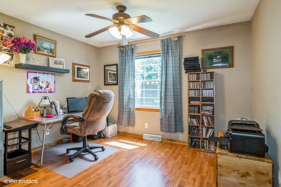 28 Jack Street Plano, IL 60545 - Photo 16 of 21 a view of a workspace with furniture and a window