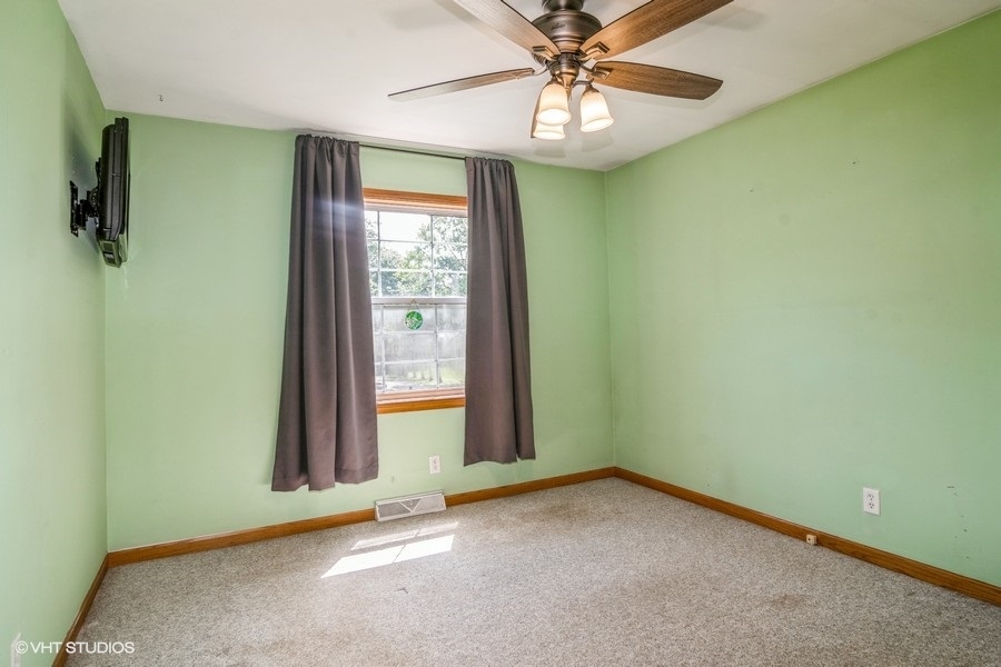28 Jack Street Plano, IL 60545 - Photo 17 of 21 an empty room with a window