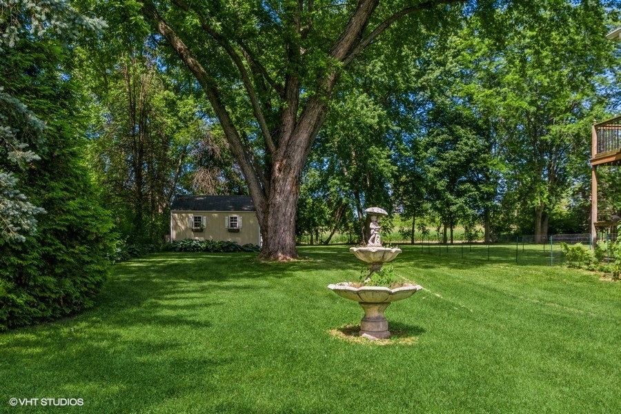 28 Jack Street Plano, IL 60545 - Photo 20 of 21 a park with a bench and trees