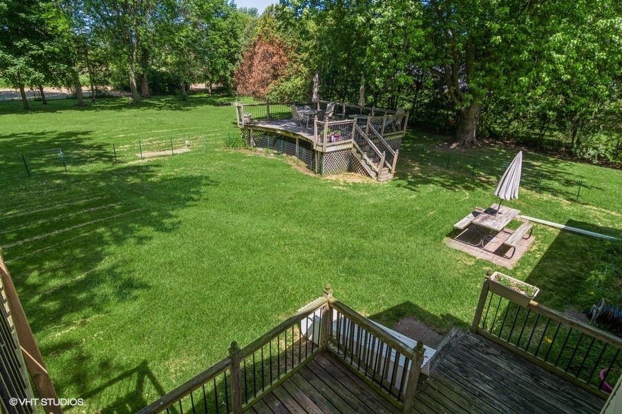 28 Jack Street Plano, IL 60545 - Photo 21 of 21 a view of a chair and table on the wooden deck