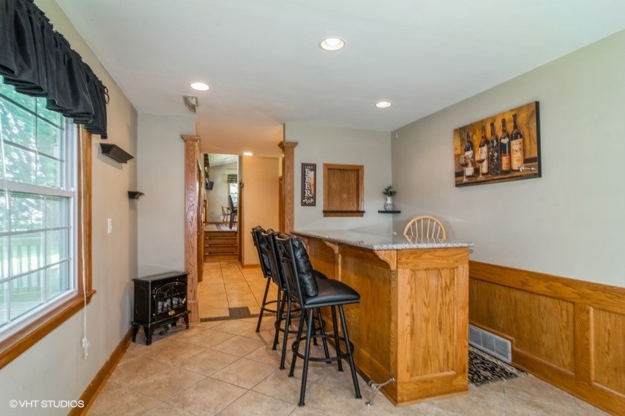 28 Jack Street Plano, IL 60545 - Photo 10 of 21 a view of a dining room with furniture and a window