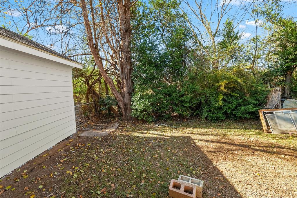 10319 Old Seagoville Road Dallas, TX 75217 - Photo 14 of 14 a view of a yard with trees