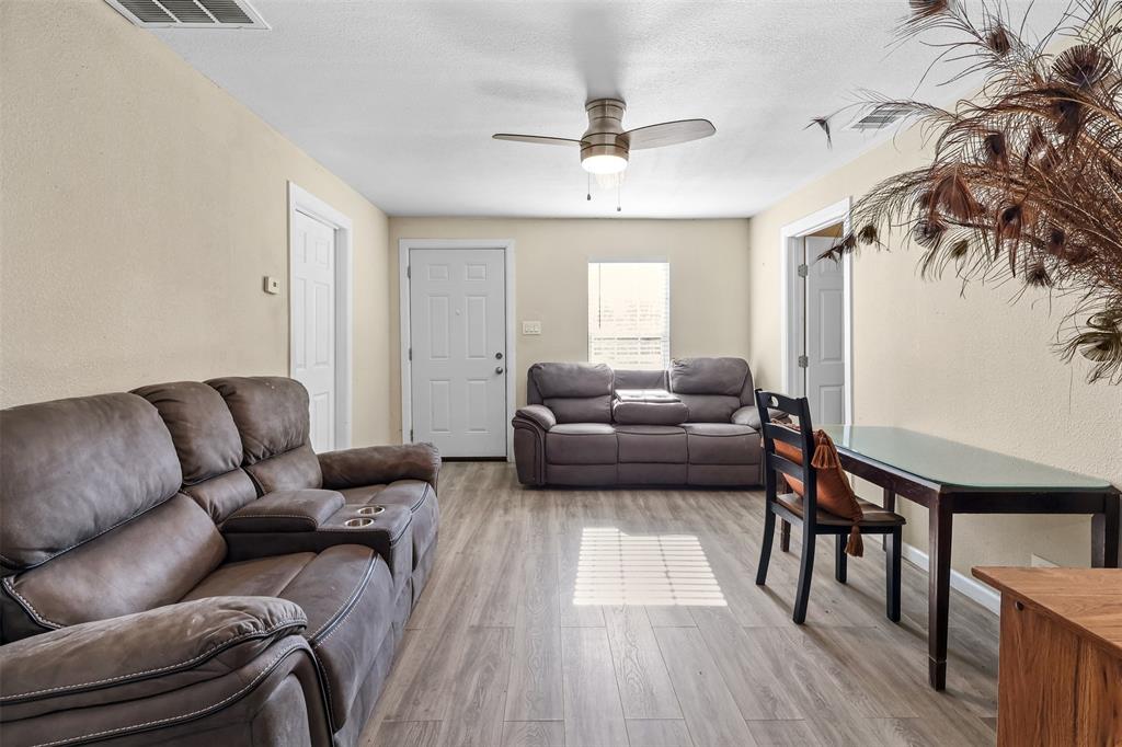 10319 Old Seagoville Road Dallas, TX 75217 - Photo 3 of 14 a living room with furniture and a wooden floor