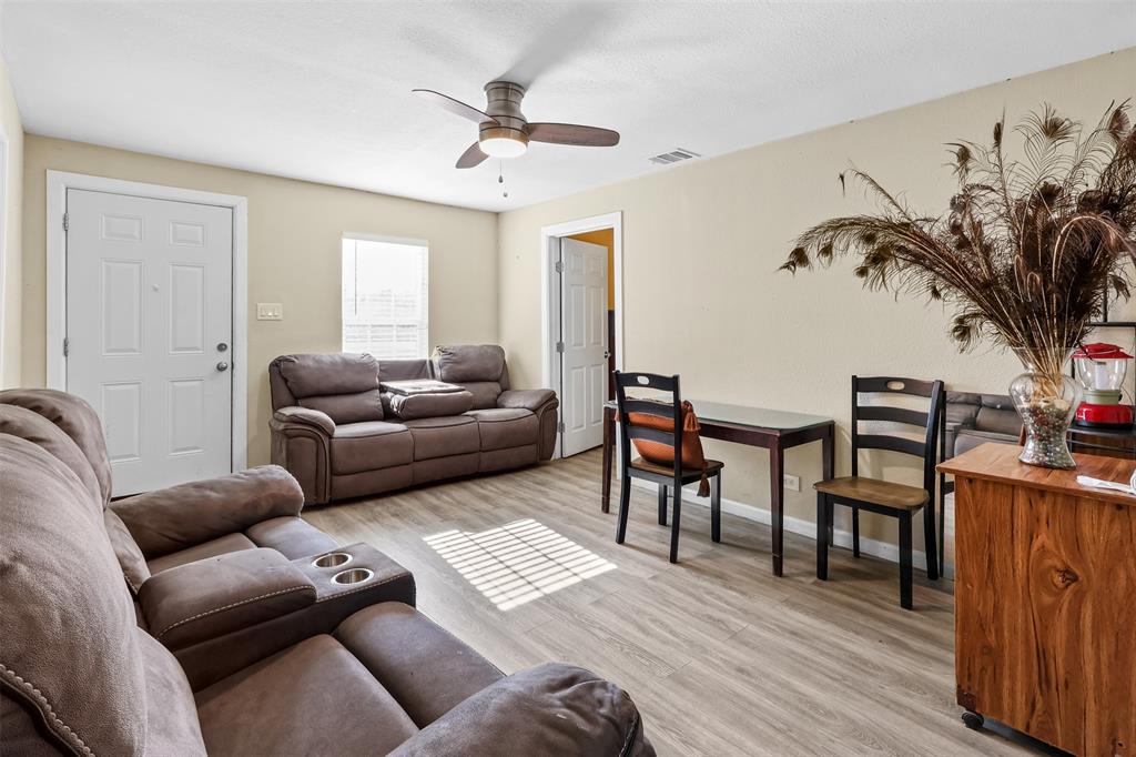 10319 Old Seagoville Road Dallas, TX 75217 - Photo 4 of 14 a living room with furniture and wooden floor