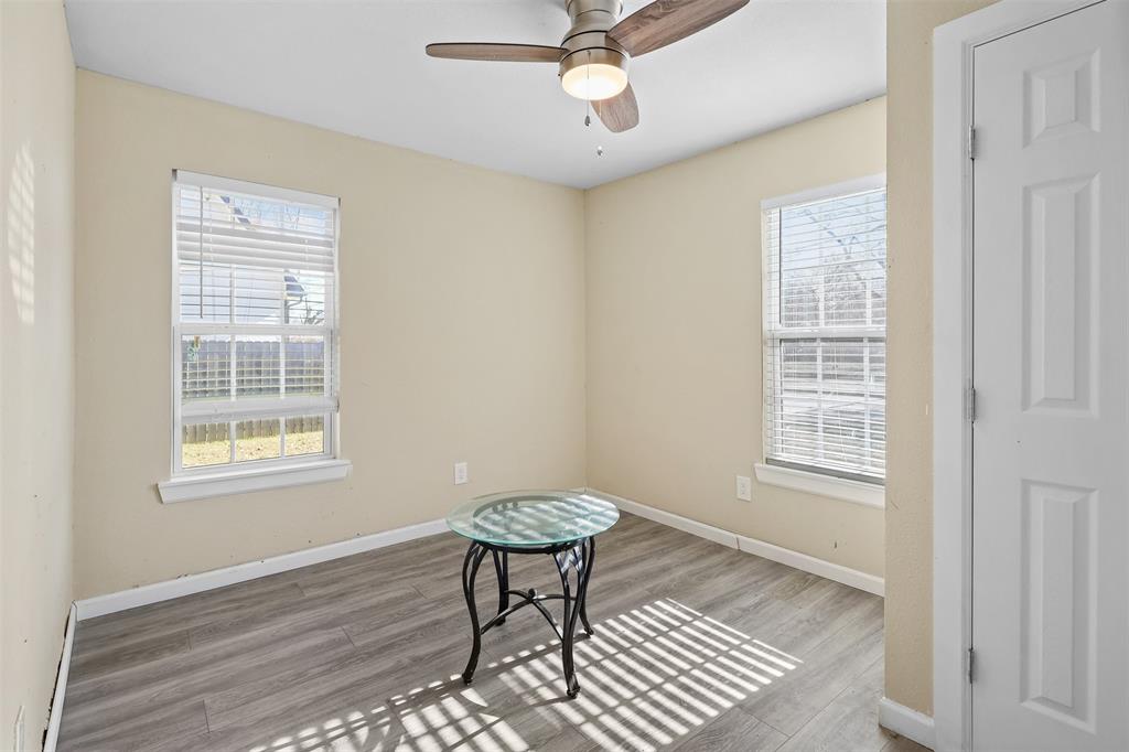10319 Old Seagoville Road Dallas, TX 75217 - Photo 5 of 14 a view of a livingroom with a lounge chair and a window