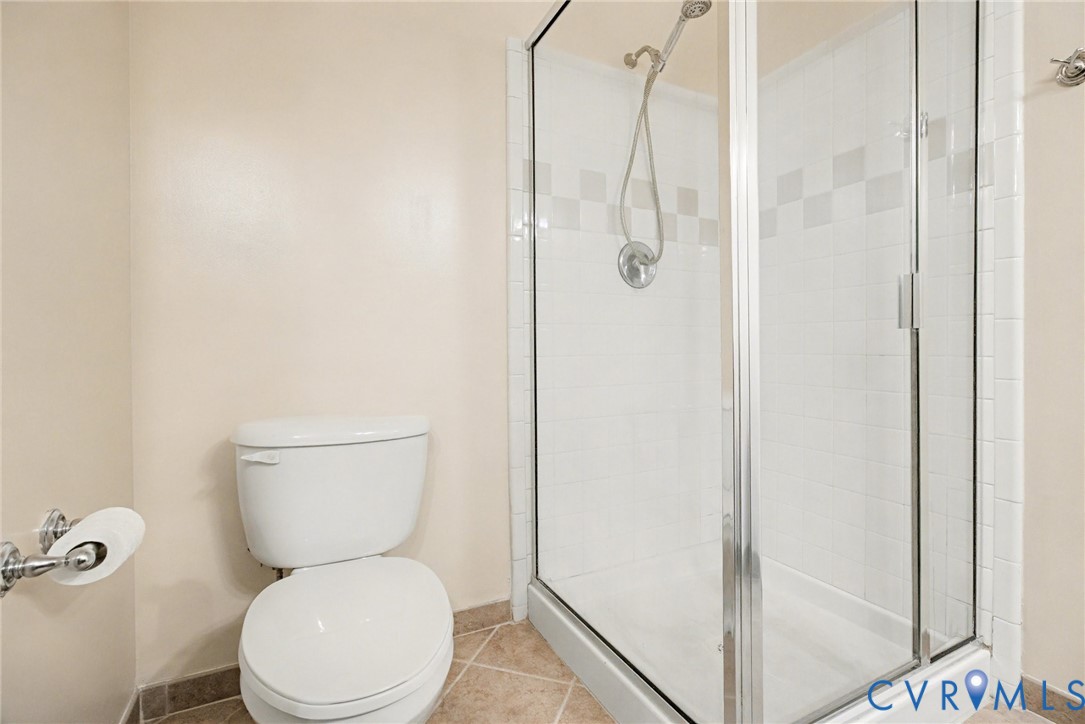 1101 Haxall Point, Unit U711 Richmond, VA 23219 - Photo 18 of 47 a white toilet sitting next to a bathroom sink