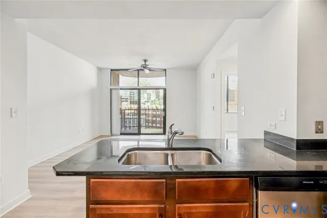a kitchen with a sink and a window