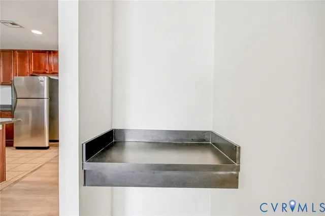 a view of a refrigerator in a kitchen