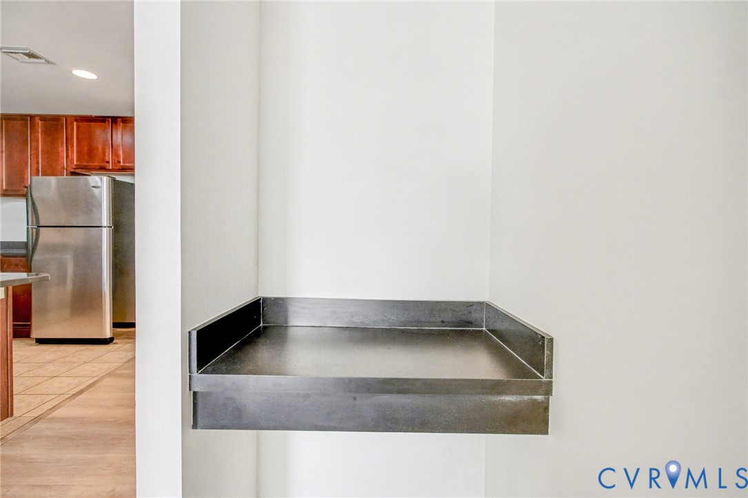 1101 Haxall Point, Unit U711 Richmond, VA 23219 - Photo 9 of 47 a view of a refrigerator in a kitchen