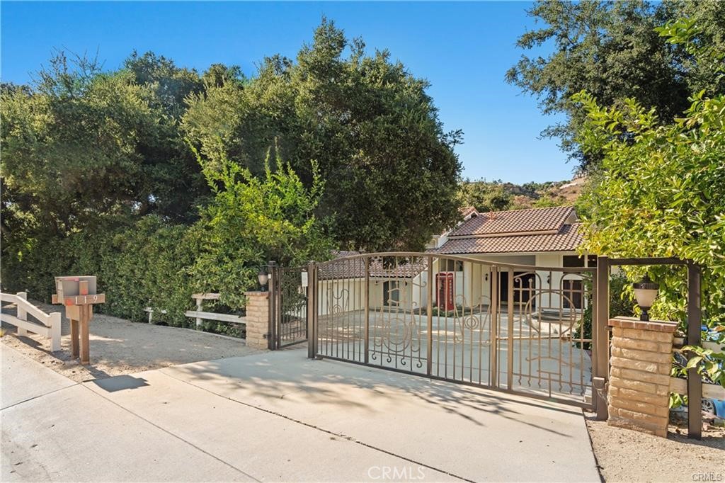 119 Bell Cyn Road Bell Canyon, CA 91307 - Photo 3 of 39 a view of a house with a iron fence