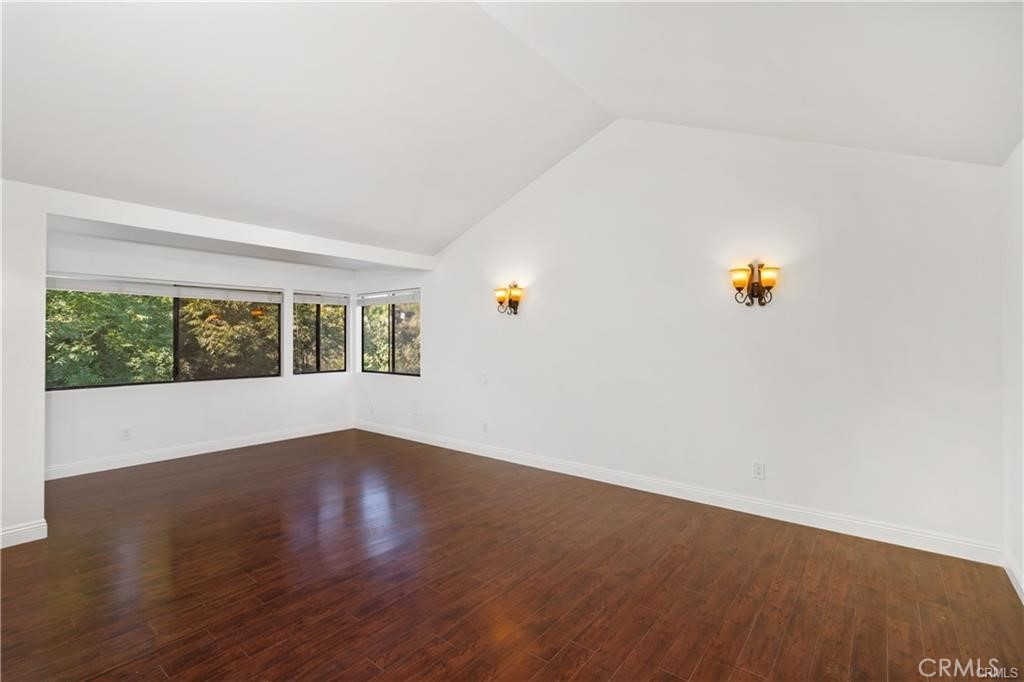 119 Bell Cyn Road Bell Canyon, CA 91307 - Photo 32 of 39 a view of an empty room with wooden floor and a window