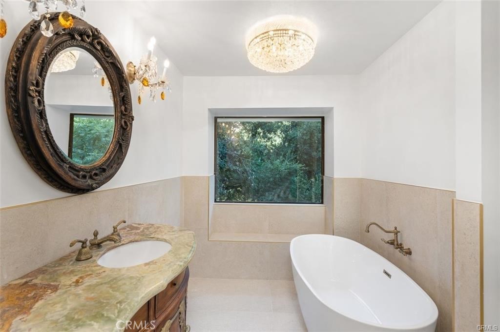 119 Bell Cyn Road Bell Canyon, CA 91307 - Photo 36 of 39 a bathroom with a sink and a mirror