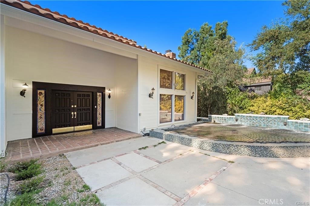 119 Bell Cyn Road Bell Canyon, CA 91307 - Photo 6 of 39 a view of a house with a yard and garage